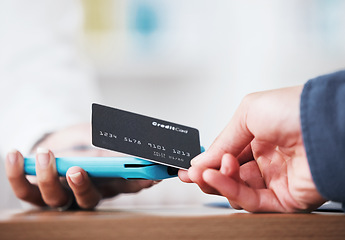 Image showing Credit card, hand and payment closeup in a store with cashier, machine and customer in a pharmacy. Shop, commerce and electronic sale with pay at POS with finance transaction and purchase at checkout