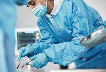 Image showing Healthcare, medical and doctor in surgery with surgical tools or equipment in the hospital. Surgeon, cardiology and woman cardiologist doing heart operation or procedure on patient in medicare clinic