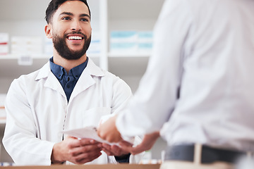 Image showing Pharmacist, man and smile with customer service in store with healthcare and medical help. Pharmacy, happy and supplements information with a male professional with package in pharmaceutical shop