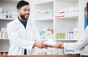 Image showing Pharmacist, man and smile with customer pills payment in store with healthcare and medical help. Pharmacy, happy and supplements information with a professional with package in pharmaceutical shop