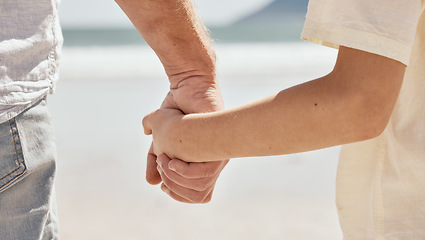 Image showing Beach, holding hands or closeup of kid with father walking or bonding together for love or care. Parent, relax or back of man with a child for support, trust or loyalty in nature on family holiday