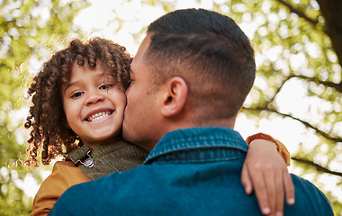 Image showing Kiss, portrait and a child and father in nature with a hug for playing, bonding or family. Happy, together and a young dad with care, love and carrying a girl kid in a park for outdoor walking