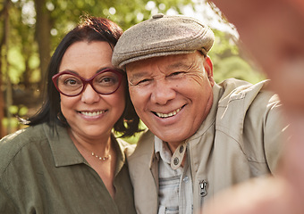 Image showing Selfie, smile and senior couple in a park happy, bond and having fun in nature together. Portrait, love and elderly man with old woman in forest for profile picture, enjoying marriage in retirement