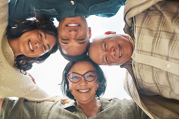 Image showing Portrait, smile and family in a huddle with senior parents from below during a summer day closeup. Love, support and elderly people with a son or daughter in law in a circle together for bonding