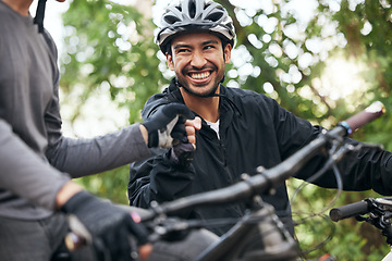 Image showing Fist bump, happy and cycling with friends in nature for fitness, health and partnership. Teamwork, motivation and sports adventure with men training in forest for wellness, workout and freedom