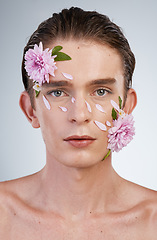 Image showing Beauty, skincare and flowers with portrait of man in studio for aesthetic, natural cosmetics or creative. Glow, self love and floral with face of model on white background for makeup, spa or wellness