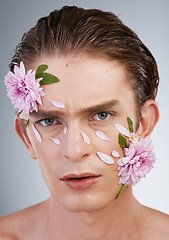 Image showing Aesthetic, skincare and flowers with portrait of man in studio for beauty, natural and creative. Head, cosmetics and glow with face of model on white background for makeup, spa and wellness
