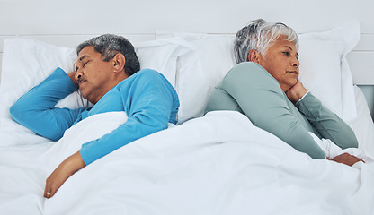 Image showing Sleeping, fighting and a senior couple in a bed with insomnia in a marriage together. Conflict, tired and elderly man and woman in the bedroom for rest in divorce and a nap with thinking in a house