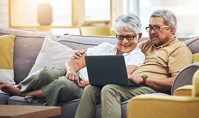 Image showing Laptop, relax and senior couple on sofa for watching movies, entertainment and streaming in living room. Retirement, love and happy man and woman on computer for internet, website and film at home