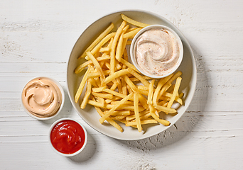 Image showing french fries with various dip sauces