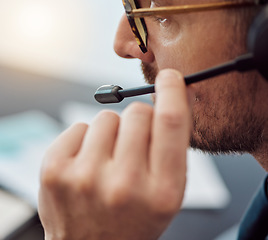 Image showing Businessman, call center and closeup of headphones in customer service, support or telemarketing at office. Man, consultant or agent talking on mic in online advice, help or contact us at workplace