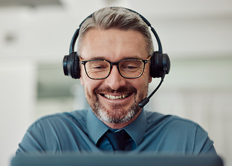 Image showing Senior, happy man and call center with headphones in telemarketing, customer service or support at office. Mature businessman, consultant or agent smile in online advice or contact us at workplace