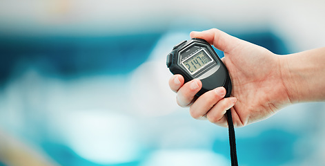 Image showing Hand, stopwatch and mockup with a fitness coach closeup in a sports center for time or training. Clock, exercise and cardio or endurance with a personal trainer for marathon motivation or challenge