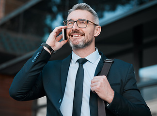 Image showing City, phone and mature businessman in conversation, travel and confidence in business networking. Ceo, manager or happy man standing on sidewalk with smartphone waiting for taxi at work with smile.