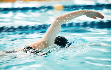 Image showing Sports, water or person training in swimming pool in race competition, exercise or cardio workout. Strong swimmer, wellness or arm of athlete exercising with fitness performance or speed in practice