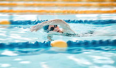 Image showing Woman, pool and swimming in sports fitness, exercise or training in water splash or athletics. Female person, athlete or professional swimmer in competition, race or marathon in workout practice