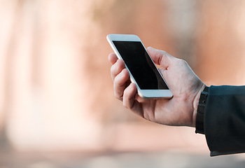 Image showing Business, hands and phone screen in city for travel, marketing and social media mockup in street. Professional person or employee on mobile app with ui or ux design space for opportunity or search