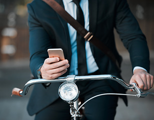 Image showing Business, phone in hands and bicycle outdoor for professional career, travel and transportation. Entrepreneur man with a bike and smartphone for internet communication, carbon footprint and journey