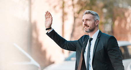 Image showing Businessman, wave hand and travel outdoor on city street for professional commute and transport. Mature entrepreneur person with gesture to stop taxi, cab or ride hailing service on urban road