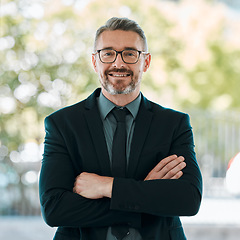 Image showing Portrait, smile and arms crossed with a business man outdoor in the city for corporate management or work. Leadership, happy and confidence with a mature manager or professional boss in an urban town