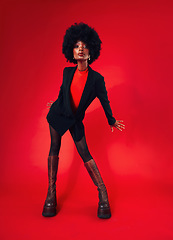 Image showing Black woman, afro and hair with fashion and shine, edgy with designer clothes and gen z isolated on red background. Mockup space, stylish clothing and trendy African model with hairstyle in a studio