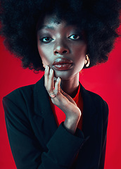 Image showing Black woman, face and afro, hair and beauty, makeup and shine isolated on red background. Hairstyle, haircare and texture with growth, skin glow in portrait and confident African model in a studio