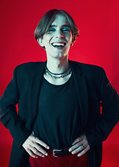 Image showing Fashion portrait, funny and gay man in makeup at studio isolated on red background. Cosmetics, lgbtq style and happy model in cool clothes, gen z aesthetic or laughing person in Australia