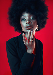 Image showing Black woman, portrait and afro, hair and beauty with makeup and shine isolated on red background. Hairstyle, haircare and texture with growth, face skin glow and confident African model in a studio