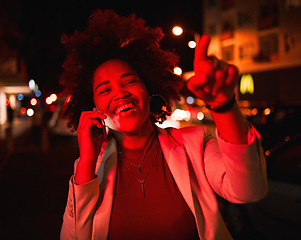 Image showing Businesswoman, phone call in street and city lights in the night, smile and pointing while waiting for taxi. Smartphone, neon red lighting and happy black woman in road with networking conversation.