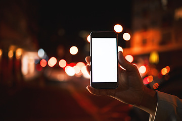 Image showing Closeup, mockup and hand with a smartphone, night and social media with digital marketing, chatting and email notification. Dark, evening and outdoor with a person, cellphone and mobile app for sms