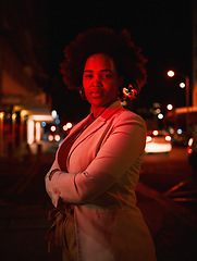 Image showing Portrait of black woman, city and night lights, standing in dark street and waiting for taxi with bokeh. Urban business fashion, late travel in Africa and serious girl in road with neon red lighting.