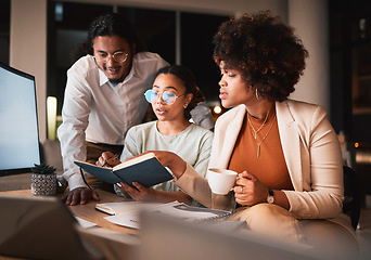 Image showing Notebook, discussion and business people in office at night for teamwork creative project. Reading, conversation and professional designers working overtime in collaboration for research in workplace