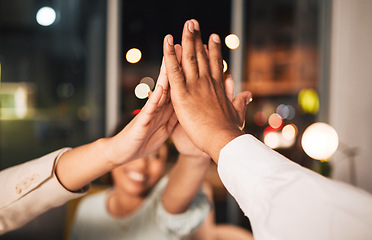 Image showing Success, closeup and business people with a high five at night for motivation or team building. Happy, dark and employees with a gesture in an office for goals, target or achievement on a deadline