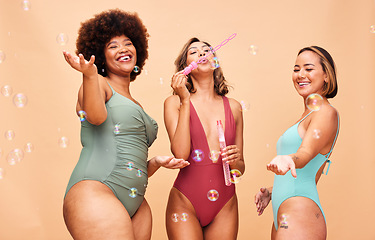 Image showing Blowing bubbles, woman and summer party with inclusion of friends in studio background or swimming, fashion or swimsuit body. Group, playing and diversity of women beauty on fun vacation or skincare