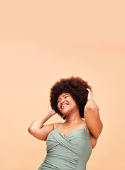 Image showing Black woman, swimwear and self love, smile and confident with body positivity in studio on peach background mockup space. Happy, person and girl in natural beauty and face for freedom in swimsuit