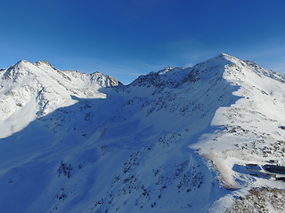 Image showing Mountain, snow and the Swiss Alps in winter for freedom, holiday or vacation with a view of nature. Environment, landscape and travel in a remote location during the cold weather season in Europe