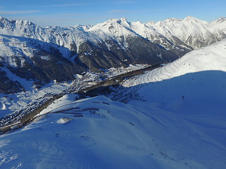 Image showing Mountain, snow and Swiss Alps terrain in winter for travel, holiday or vacation with a view of nature. Environment, landscape and earth in a remote location during the cold weather season in Europe