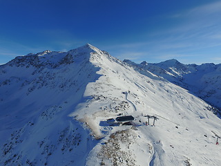 Image showing Mountains, snow and the Swiss Alps in winter for travel, holiday or vacation with a view of nature. Environment, landscape and freedom in a remote location during the cold weather season in Europe