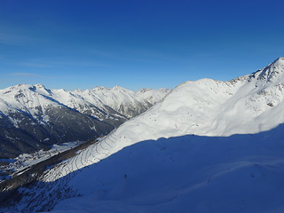 Image showing Mountain, snow and the Swiss Alps landscape for travel, holiday or vacation with a view of nature. Environment, winter and adventure in a remote location during the cold weather season in Europe