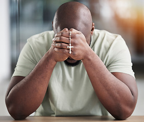 Image showing Prayer, rosary and hands of black man for worship, faith and belief for support, help and hope. Religion, praying and christian person in home for meditation, spiritual healing and trust for praise