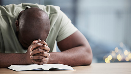 Image showing Bible, reading and man praying with book and religion study at home for worship and spiritual support. Faith, christian knowledge and person with gratitude, scripture education and guidance in house