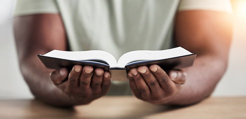 Image showing Bible, book reading and hands with closeup of religion study at home for worship and spiritual support. Faith, christian knowledge and person with gratitude, scripture education and god guidance