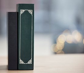 Image showing Bible on table, mockup space and bokeh for religion, reading and study in faith education. Holy books, desk and spiritual for learning, gospel knowledge and information to worship on a background