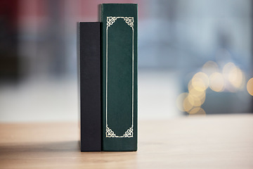 Image showing Books on table, mockup space and bokeh for religion, reading and study in faith education. Holy bible, desk and spiritual for learning, gospel knowledge and information to worship on a background