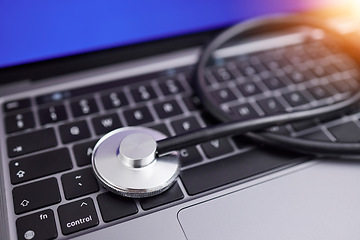 Image showing Computer, stethoscope and online for medical advice, professional, or expert in healthcare, cardiology and care. Contact us, laptop and pc keyboard to search for nurse, doctor or health specialist