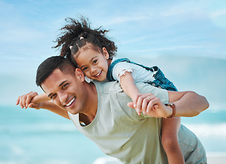 Image showing Piggy back, portrait and father with girl, travel and vacation with energy, summer break and playful together. Happy family, dad carrying female child and kid with seaside holiday, smile or adventure