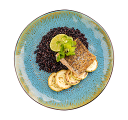 Image showing Fried salmon steak with black rice