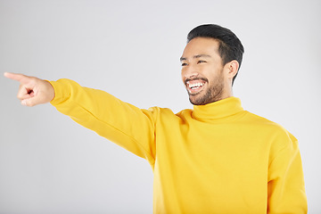 Image showing Indian, man and pointing hand in studio to show fashion promotion, offer or excited for deal on white background. Choice, gesture mockup and presentation of information with person showing space