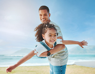 Image showing Dad, playing and girl as a plane on beach for fun game on vacation, holiday or freedom to travel to the ocean in Miami. Child, flying and dad with kid to support, play and bonding together in summer