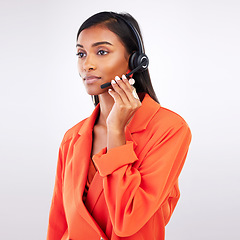 Image showing Call center, listening and woman telemarketing, support and help in studio isolated on a white background. Contact us, customer service agent and sales consultant on microphone for thinking of crm